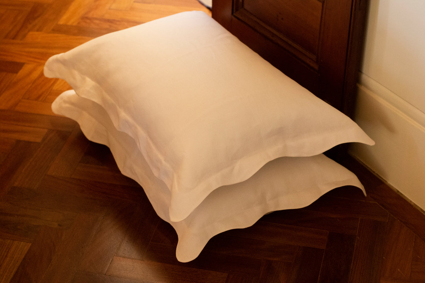 White wave/wiggle edge pillowcases, stacked.