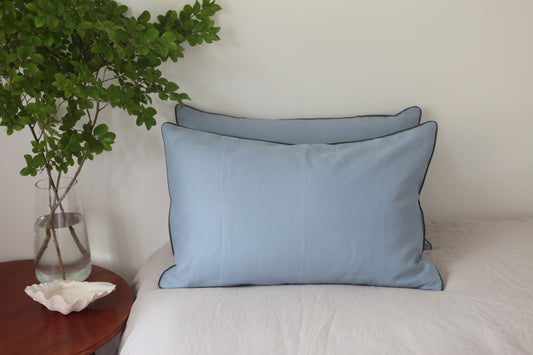 Sky Blue linen pillowcases with khaki linen piping. Front on photo. 