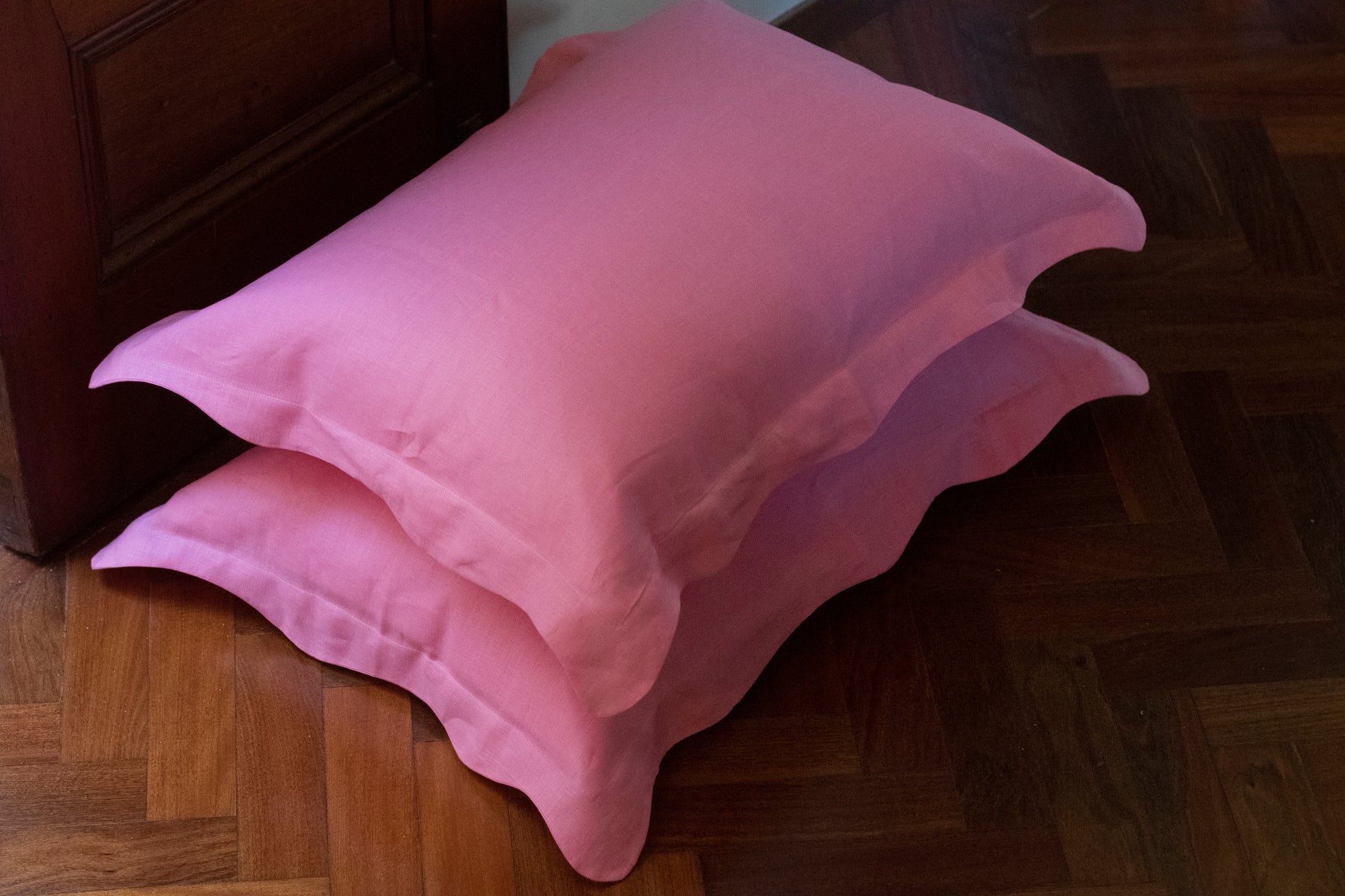 Baby pink wiggle edge pillowcases stacked. 